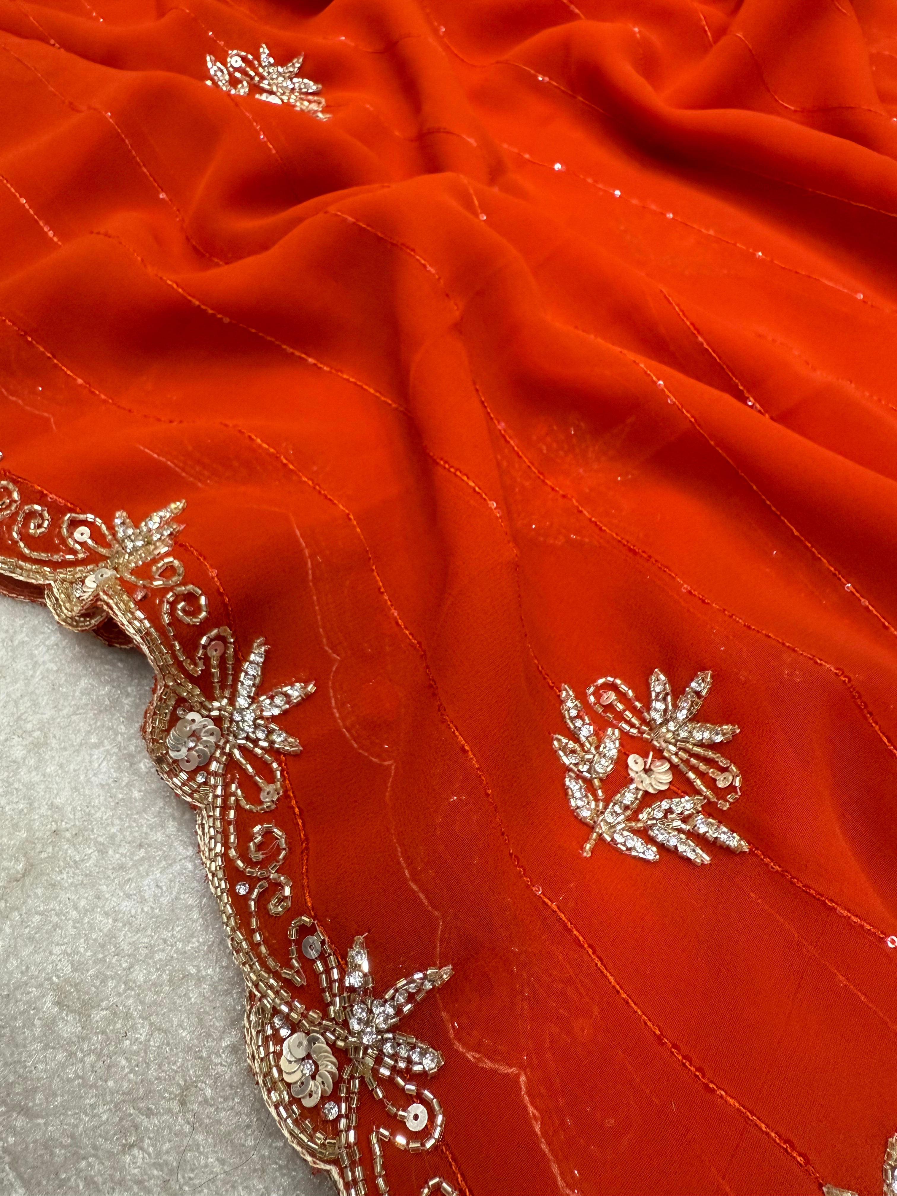 Royal Zari Exclusive: Rust Orange Georgette Handwork Saree with Unstitched Blouse
