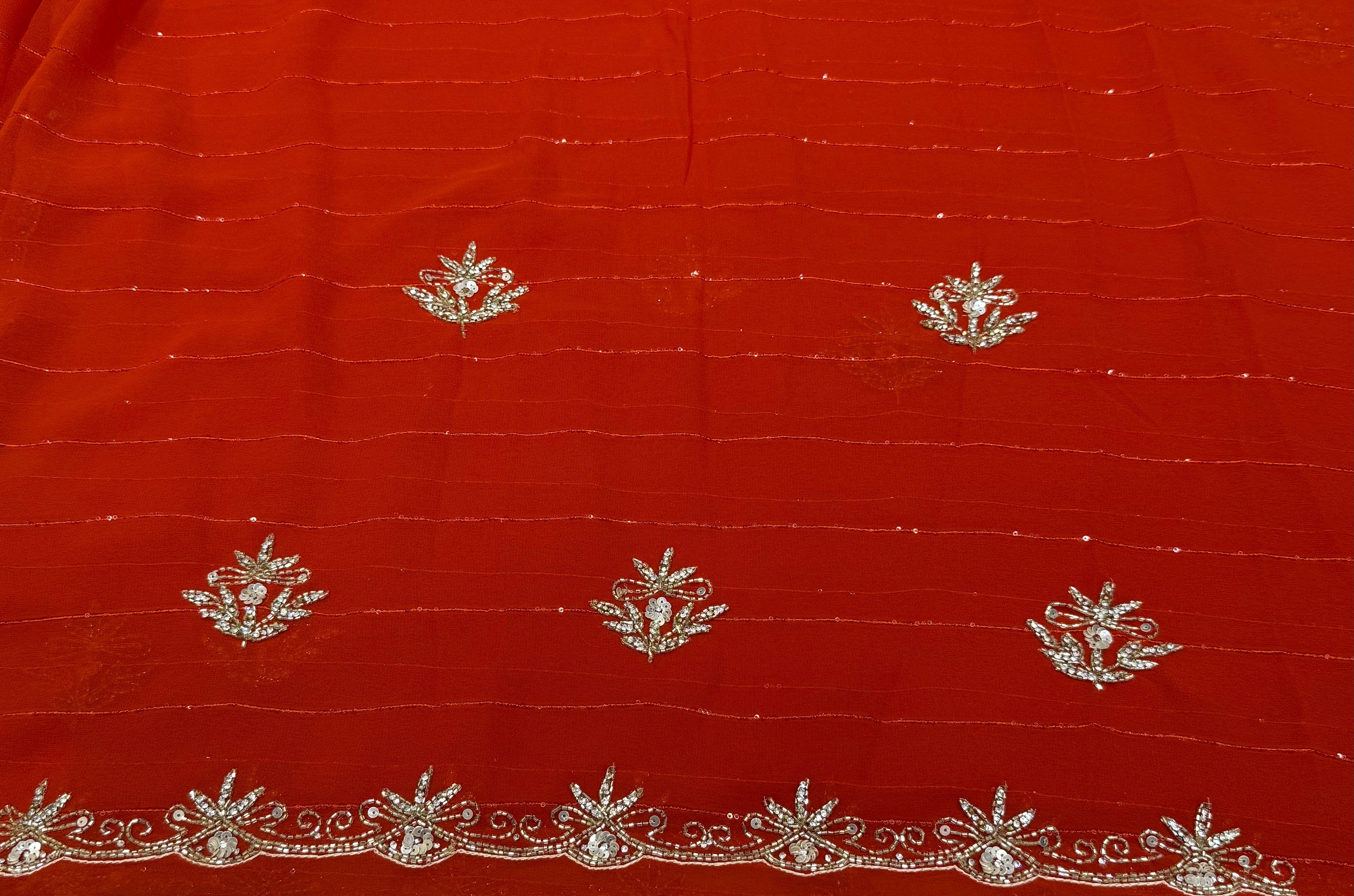 Royal Zari Exclusive: Rust Orange Georgette Handwork Saree with Unstitched Blouse